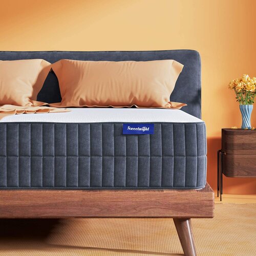 The Sweetnight Hybrid mattress is shown on a wooden bed frame. Priced at $598 for a king size, it is a well made hybrid mattress option that is comfortable and well rated.