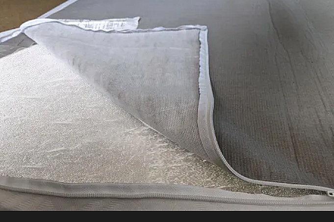 Where to buy a mattress without fiberglass. Expert's guide to fiberglass free mattress made using organic wool, thistle pulp fiber, and other options as a fire barrier.